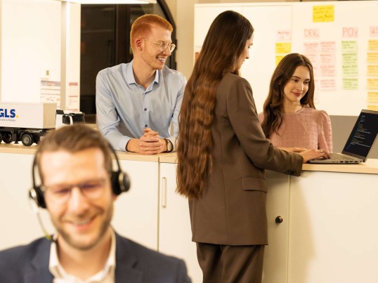 Employees working together in the open office space