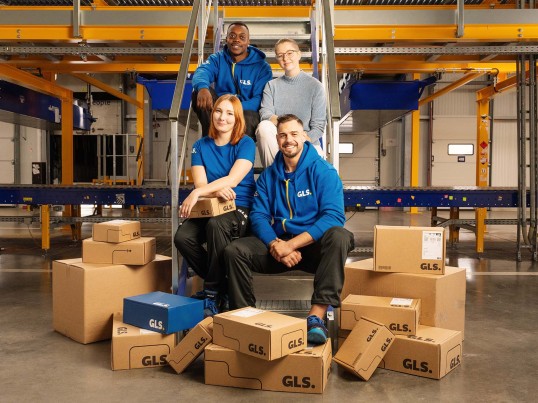 Employees sitting on stairs in the depot
