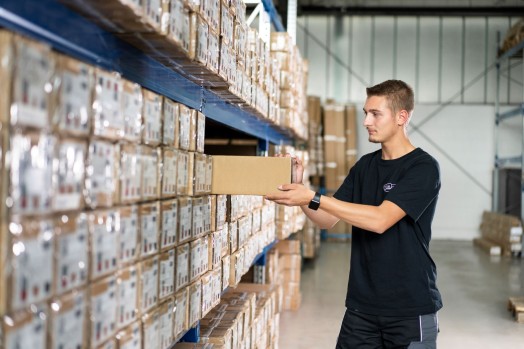 Employee sorts packages in the warehouse